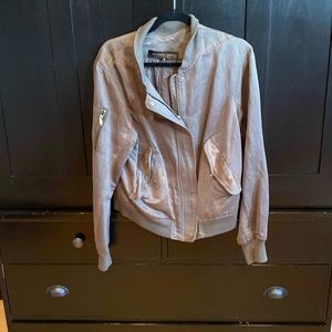 Fairy khaki bomber jacket has slight tear in back